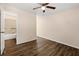 Bedroom with wood-look flooring and a ceiling fan; bathroom accessible at 1248 Falling Water Se Dr, Smyrna, GA 30080