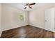 This bedroom has a ceiling fan and a view to the outside at 1248 Falling Water Se Dr, Smyrna, GA 30080