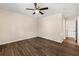 Bedroom showcasing hardwood floors, ceiling fan and access to hallway at 1248 Falling Water Se Dr, Smyrna, GA 30080