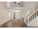 Bright living room showcasing hardwood floors, staircase and open floor plan at 1248 Falling Water Se Dr, Smyrna, GA 30080