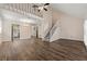 Open floor plan showcasing living area with hardwood floors, staircase, and view into the kitchen at 1248 Falling Water Se Dr, Smyrna, GA 30080
