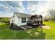 The house has a covered deck, well-maintained lawn, and flower beds at 273 Crowe Springs Nw Rd, Cartersville, GA 30121