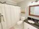 Cozy bathroom featuring a shower and tub, vanity, and neutral decor at 273 Crowe Springs Nw Rd, Cartersville, GA 30121