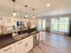 Modern kitchen with granite countertops, stainless steel appliances, and an open floor plan at 273 Crowe Springs Nw Rd, Cartersville, GA 30121