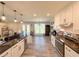 Bright kitchen featuring stainless steel appliances, granite countertops, and wood-look flooring at 273 Crowe Springs Nw Rd, Cartersville, GA 30121