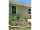 Landscaped backyard featuring decorative plants and charming garden accents at 3455 Buffington Ln, Cumming, GA 30040