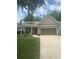 Charming single-story home featuring a two-car garage and a beautifully landscaped front yard at 3455 Buffington Ln, Cumming, GA 30040