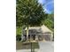 Charming home with a welcoming front porch, well-manicured lawn, and a two-car garage at 3455 Buffington Ln, Cumming, GA 30040