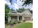 Charming single-story home featuring a well-manicured front yard and a two-car garage at 3455 Buffington Ln, Cumming, GA 30040