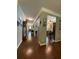 Long hallway with hardwood floors, leading to other areas of the home at 3455 Buffington Ln, Cumming, GA 30040