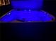 Illuminated hot tub at night with jets and seating at 3455 Buffington Ln, Cumming, GA 30040