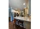 Well-equipped kitchen with stainless steel appliances, granite countertops, and a breakfast bar with seating at 3455 Buffington Ln, Cumming, GA 30040