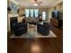 Comfortable living room with fireplace, hardwood floors, and neutral colors at 3455 Buffington Ln, Cumming, GA 30040