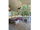 Inviting screened porch featuring brick flooring and a charming seating area at 3455 Buffington Ln, Cumming, GA 30040