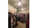 Well-organized walk-in closet with ample shelving and hanging space for clothing storage at 3455 Buffington Ln, Cumming, GA 30040