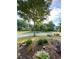 Well-maintained front yard with vibrant flowerbeds and lush greenery for an inviting curb appeal at 3455 Buffington Ln, Cumming, GA 30040