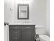 Bathroom vanity features updated hardware, new mirror, and tile backsplash at 995 Litchfield Pl, Roswell, GA 30076