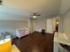 Spacious bedroom featuring wood floors, a ceiling fan, a window, and neutral paint at 995 Litchfield Pl, Roswell, GA 30076