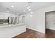 Contemporary kitchen features stainless steel appliances, granite countertops, and a stylish pendant light fixture at 995 Litchfield Pl, Roswell, GA 30076