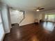 Inviting living room with hardwood floors, natural light, staircase, and an open floor plan at 995 Litchfield Pl, Roswell, GA 30076