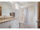 Bathroom with marble countertop vanity and shower with a curtain at 3080 Dickson Ne St, Brookhaven, GA 30319