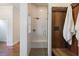 This bathroom features a glass shower with a bench and wood accents at 3080 Dickson Ne St, Brookhaven, GA 30319