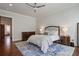 This bedroom has hardwood floors, ceiling fan, dresser and night stands at 3080 Dickson Ne St, Brookhaven, GA 30319