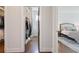 A hallway view from the closet to the bedroom with hardwood floors at 3080 Dickson Ne St, Brookhaven, GA 30319