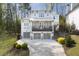 Stunning two-story home features a balcony, three-car garage, and professionally landscaped yard at 3080 Dickson Ne St, Brookhaven, GA 30319