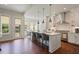 Bright and spacious kitchen featuring an island with seating, stainless steel appliances, and ample counter space at 3080 Dickson Ne St, Brookhaven, GA 30319