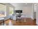 Home office featuring hardwood floors, lots of natural light and textured accent wall at 3080 Dickson Ne St, Brookhaven, GA 30319