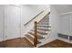 Staircase featuring hardwood floors and white risers at 3080 Dickson Ne St, Brookhaven, GA 30319