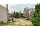 View of the fenced backyard, landscaping, and the outdoor living space beneath the screened porch at 6675 Flagstone Ct, Cumming, GA 30028