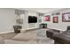 Basement features comfortable seating, lots of decor, plush carpet, and a modern TV at 6675 Flagstone Ct, Cumming, GA 30028