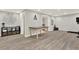 Spacious basement with hardwood floors, neutral walls, large table, and additional workout equipment at 6675 Flagstone Ct, Cumming, GA 30028
