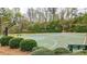 Community basketball court surrounded by lush landscaping provides residents an athletic space for exercise and enjoyment at 6675 Flagstone Ct, Cumming, GA 30028