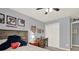 A light-filled bedroom with neutral walls, sports decor, and plenty of natural light at 6675 Flagstone Ct, Cumming, GA 30028