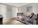 Neutral bedroom with a bed, teddy bear, and signs, illuminated by recessed lighting at 6675 Flagstone Ct, Cumming, GA 30028