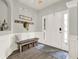 Welcoming foyer featuring hardwood floors, wainscoting, and stylish decor, perfect for a first impression at 6675 Flagstone Ct, Cumming, GA 30028