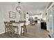Open kitchen layout with kitchen island that opens up to the living room and dining room at 6675 Flagstone Ct, Cumming, GA 30028
