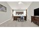 Spacious main bedroom with a large bed, dresser, carpeted floors, and natural light at 6675 Flagstone Ct, Cumming, GA 30028