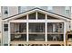 Spacious screened porch with string lights, furniture, and an airy atmosphere at 6675 Flagstone Ct, Cumming, GA 30028