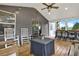 Relaxing screened porch with dining and lounge area with views of the trees at 6675 Flagstone Ct, Cumming, GA 30028