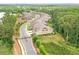 An aerial view of a community with well-maintained lawns and lush greenery at 2940 W Village Dr # 60, Suwanee, GA 30024