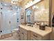Modern bathroom with a glass-enclosed shower, marble countertops, and stylish fixtures at 2940 W Village Dr # 60, Suwanee, GA 30024