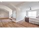 Spacious bedroom with ample natural light, a ceiling fan, and neutral color scheme at 2940 W Village Dr # 60, Suwanee, GA 30024