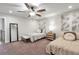 Cozy bedroom with two twin beds, a ceiling fan, and soft neutral decor at 2940 W Village Dr # 60, Suwanee, GA 30024