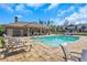 Resort-style pool with inviting lounge chairs and meticulously kept landscaping at 2940 W Village Dr # 60, Suwanee, GA 30024