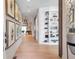 Elegant entryway with hardwood floors, built-in shelving, and stylish decor, creating a welcoming atmosphere at 2940 W Village Dr # 60, Suwanee, GA 30024