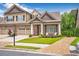Charming home featuring a manicured front yard and welcoming entrance at 2940 W Village Dr # 60, Suwanee, GA 30024